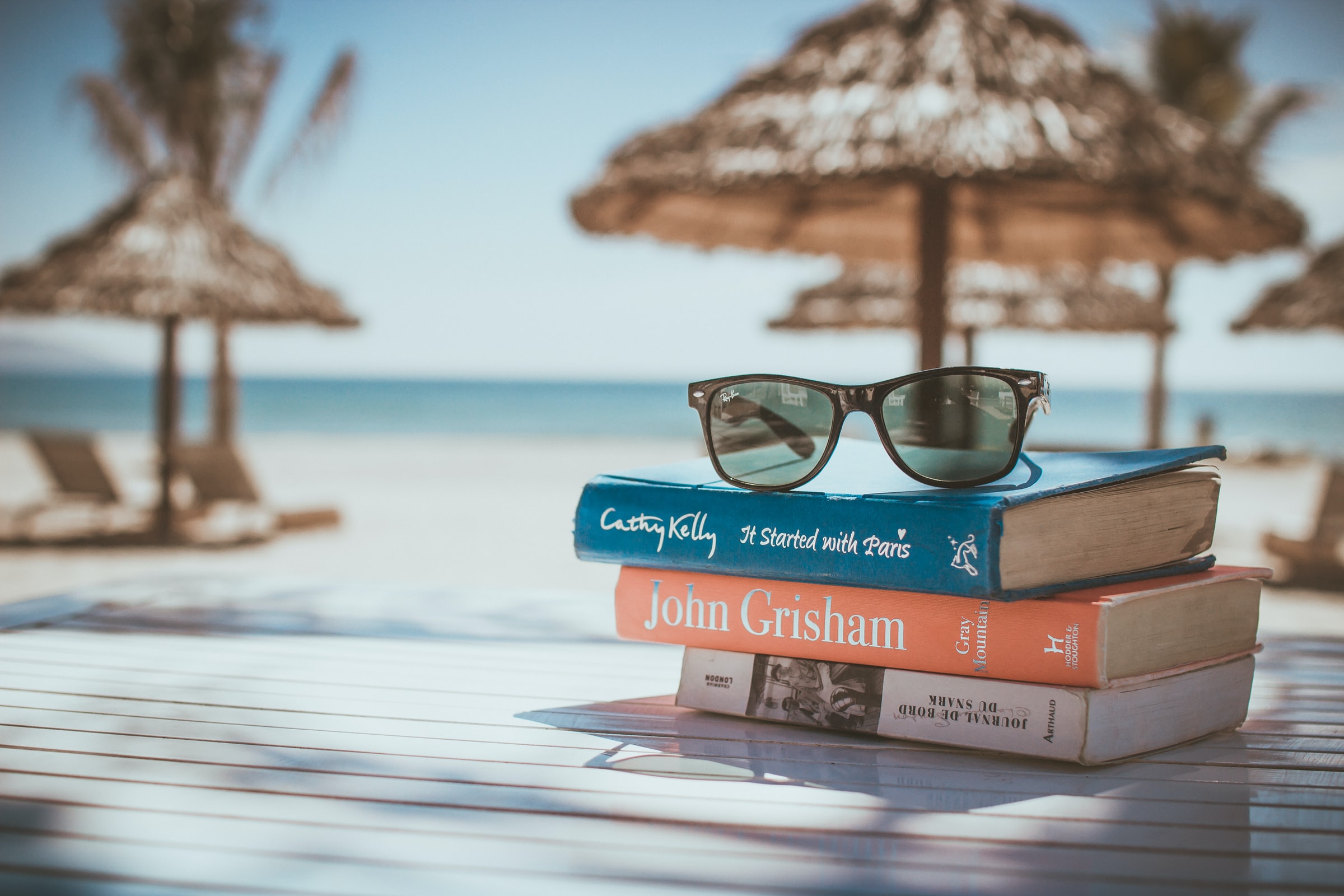 books on a table at a beach